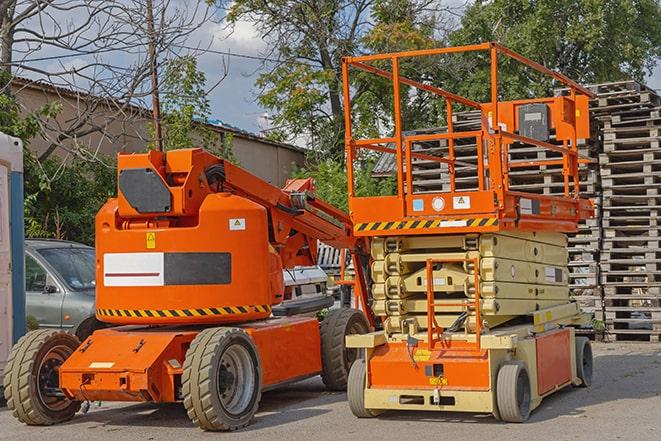 worker operating forklift in bustling warehouse environment in Burgin